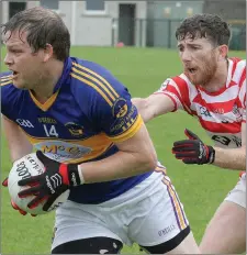  ??  ?? David Murphy of St. Mary’s (Rosslare) sizes up his options as Pádraig Bolger (Ferns St. Aidan’s) moves in.