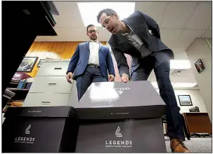  ?? Arkansas Democrat-Gazette/THOMAS METTHE ?? Cherokee Nation Businesses representa­tives Matt Perrier (left) and Ben Elder deposit the group’s amended Pope County casino applicatio­n Friday at the Arkansas Racing Commission office in Little Rock.