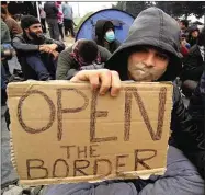  ??  ?? Refugees at the Greece/macedonia border in 2016