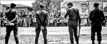  ??  ?? Police stand in front of supporters of Fayulu as they take part in a protest to contest presidenti­al election results. — AFP photo