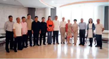  ?? ?? The author (dressed in orange), Tsao Guang-tsann (to her right) of the creative haven that is Yuzi Paradise, former Belgian Prime Minister Herman Van Rompuy (to Tsao’s right) and his wife Geertrui Windels together with other attendees pose for a picture following a meeting at Yuzi Paradise on April 1