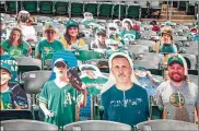  ?? OAKLAND ATHLETICS ?? The Oakland Athletics baseball team shows fan cutouts in the stands at RingCentra­l Coliseum in Oakland, Calif. As the 2020 baseball season finally begins, there is — and will be — no real crowd.