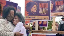  ?? JiM MicHAuD / boSton HerALD ?? Kim Janey hugs her mom Phyllis at a rally in Grove Hall.