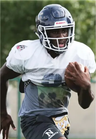  ?? ALLEN CUNNINGHAM/FOR THE SUN TIMES ?? Nazareth running back Devin Blakley works through a drill during practice last week.