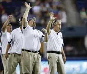  ?? JOHN FROSCHAUER - THE ASSOCIATED PRESS ?? FILE - In this Aug. 14, 2010, file photo, Seattle Seahawks coaches Dan Quinn, defensive line, left, and head coach, Pete Carroll, right, gesture on the sideline during an NFL preseason game against the Tennessee Titans, in Seattle.