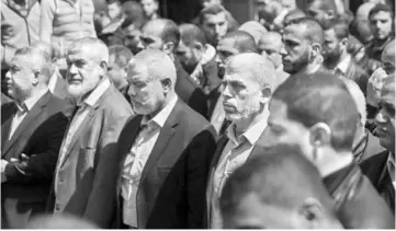  ??  ?? Yahya Sinwar (centre right), the new leader of Hamas in the Gaza Strip and senior political leaders of the Islamist movement, Ismail Haniyeh (centre left) and Rawhi Moshtaha (second left) attend the funeral of Mazen Faqha in Gaza city. — AFP photo