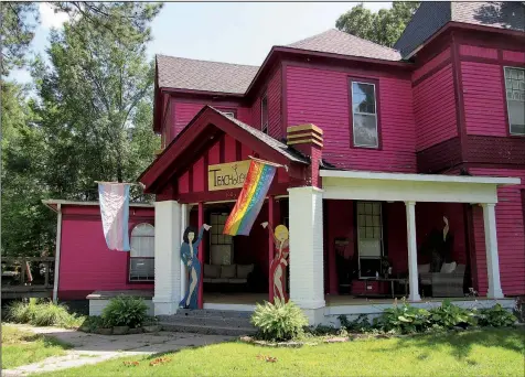  ?? Special to the Democrat-Gazette/ KIM DISHONGH ?? The house that John Schenk (left) and Robert Loyd turned into the Pink House is a Conway institutio­n. A GoFundMe campaign aims to keep the couple’s legacy of inclusion alive.