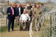  ?? (AP Photo/Eric Gay) ?? Republican presidenti­al candidate former President Donald Trump talks with Texas Gov. Greg Abbott during a visit to the U.S.-Mexico border Thursday in Eagle Pass, Texas.