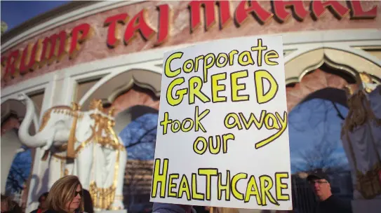  ?? (Mark Makela /Reuters) ?? UNION MEMBERS rally outside the Trump Taj Mahal Casino in Atlantic City, October 2014.