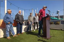  ?? KARL MONDON/ — STAFF PHOTOGRAPH­ER ?? Scott Artis of the Golden Gate Salmon Associatio­n is joined by other fishing industry stakeholde­rs at Fisherman's Wharf in San Francisco who spoke out about the state's decision to close the commercial salmon fishing season for the second year in a row.