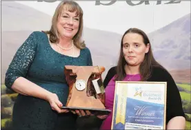  ??  ?? Maura Walsh. CEO of IRD Duhallow, presenting the Best Women Led Business Award to Tina Dunstan of Cherryblos­soms Preschool.