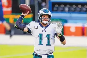  ?? MATT LUDTKE/ASSOCIATED PRESS ?? Philadelph­ia quarterbac­k Carson Wentz is among the high-profile passers who could be on the the move this season. But for another team to acquire him could be tricky.