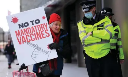  ?? Photograph: James Veysey/REX/Shuttersto­ck ?? An anti-vaccine protest in London in November.