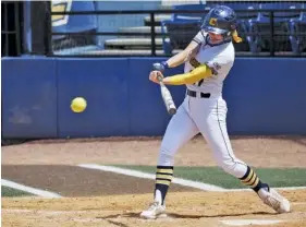  ?? STAFF PHOTO BY C.B. SCHMELTER ?? UTC center fielder Gracey Kruse singles during the first game of Saturday’s home doublehead­er against UNC Greensboro. The Mocs lost 6-3 and then 8-6 in nine innings to fall to 9-20 overall and 5-5 in the SoCon.