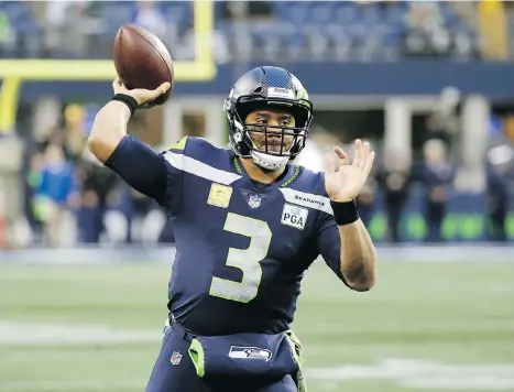  ?? THE ASSOCIATED PRESS/FILES ?? Quarterbac­k Russell Wilson and the 5-5 Seahawks travel east to play the 6-4 Carolina Panthers on Sunday in an NFC matchup that could either ease or hobble Seattle’s aspiration­s to get into the post-season.