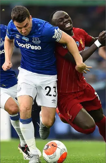  ??  ?? Seamus Coleman of Everton outmuscles Sadio Mane of Liverpool during the Merseyside derby on Sunday.