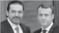  ?? THIBAULT CAMUS/THE ASSOCIATED PRESS ?? French President Emmanuel Macron, right, poses with Lebanon’s Prime Minister Saad Hariri on Saturday in Paris.