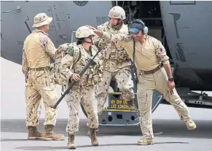  ?? THE CANADIAN PRESS ?? Canadian troops arrive at a UN base in Gao, Mali, on Monday.