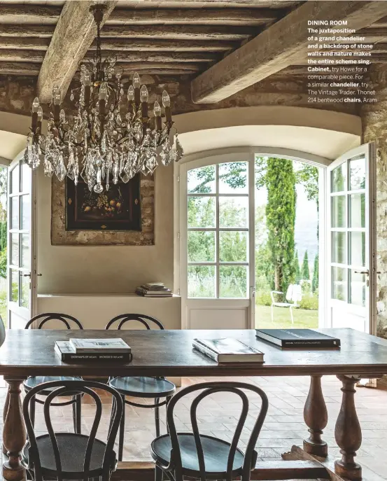  ??  ?? DINING ROOM
The juxtaposit­ion of a grand chandelier and a backdrop of stone walls and nature makes the entire scheme sing. Cabinet, try Howe for a comparable piece. For a similar chandelier, try The Vintage Trader. Thonet 214 bentwood chairs, Aram