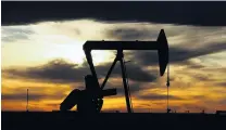  ?? PHOTO: REUTERS ?? Going down . . . The sun sets behind a crude oil pump jack on a drill pad in Texas.