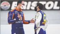  ?? Jared C. Tilton / Getty Images ?? Joey Logano, left, talks with Chase Elliott after the NASCAR Cup Series Food City presents the Supermarke­t Heroes 500 at Bristol Motor Speedway on Saturday.