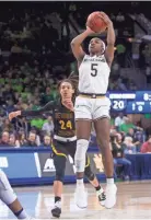  ?? AP ?? Notre Dame’s Jackie Young goes up for a shot in front of Bethune-cookman’s Angel Golden on Saturday in South Bend, Ind.