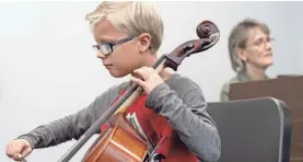  ?? FRANCIS GARDLER/LINCOLN JOURNAL STAR VIA AP ?? Carter Frey plays his cello.