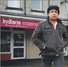  ?? ?? Raj Verma stands outside the Indian Cuisine restaurant he owns in Fairbourne.