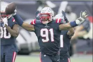  ?? CHARLES KRUPA— THE ASSOCIATED PRESS ?? Patriots defensive lineman Deatrich Wise Jr. celebrates after recovering a fumble in the end zone for a touchdown in the second half of a game against the Raiders in Foxborough on Sept. 27.