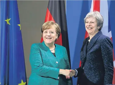  ?? Picture: AP. ?? German chancellor Angela Merkel, left, and Prime Minister Theresa May after a press conference in Berlin yesterday.