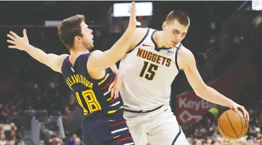  ?? TONY DEJAK/THE ASSOCIATED PRESS FILES ?? Denver Nuggets centre Nikola Jokic is one of a three star athletes to have been reported to have tested positive for COVID-19 in recent days.