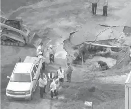  ?? WSVN-7/COURTESY ?? Frame grab from aerial video of a damaged water main along the 2500 block of Northwest 55th Court, near the Fort Lauderdale Executive Airport, on July 18.