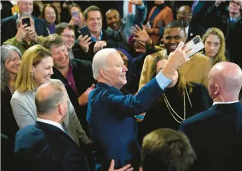  ?? PATRICK SEMANSKY/AP ?? President Joe Biden takes a photo at a union training facility Wednesday in DeForest, Wisconsin.