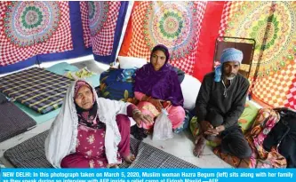  ??  ?? NEW DELHI: In this photograph taken on March 5, 2020, Muslim woman Hazra Begum (left) sits along with her family as they speak during an interview with AFP inside a relief camp at Eidgah Masjid.—AFP