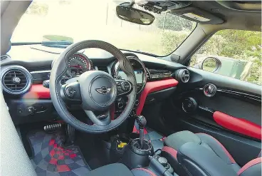  ??  ?? The 2017 Mini Cooper JCW 3 Door has a more sophistica­ted interior than the Honda Civic Type R.