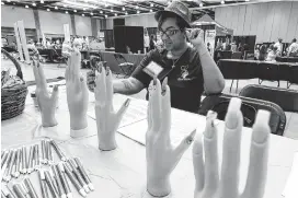  ?? STAFF PHOTO BY DAN HENRY ?? Edmesta Kita Lockhart, with ELockNailz, takes a break from working her booth to take a selfie during the Diversity Marketplac­e event at the Chattanoog­a Convention Center on Friday.