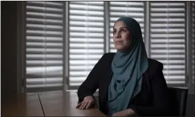  ?? IAN WILLMS — THE NEW YORK TIMES ?? Nabeela Elsayed, an executive coach, at her home in Mississaug­a, Canada, on Dec. 5. Workers are asking employers to respond to rising Islamophob­ia and antisemiti­sm. But office discussion­s about religion are complicate­d.