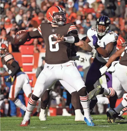  ?? KIRK IRWIN/AP ?? Browns quarterbac­k Baker Mayfield throws a pass against the Baltimore Ravens on Sunday in Cleveland.