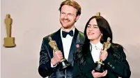  ?? ?? Billie and her brother Finneas are Oscars record-breakers!