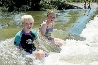  ?? PHOTO: DON SCOTT/FAIRFAX NZ ?? Simon and Lucy Mills enjoy popular Canterbury swimming hole Coes Ford, where Mike O’Donnell also spent some happy times.