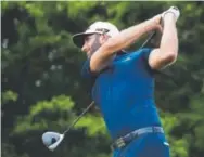  ?? Getty Images ?? Dustin Johnson, hitting a tee shot Sunday at Kapalua in Hawaii, closed with an 8-under 65 and won the Sentry Tournament of Champions by eight shots.