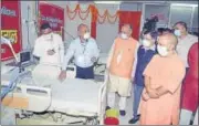  ?? HT PHOTO ?? CM Yogi Adityanath speaking to authoritie­s after dedicating a 320-bed Covid hospital on KGMU campus on Monday.