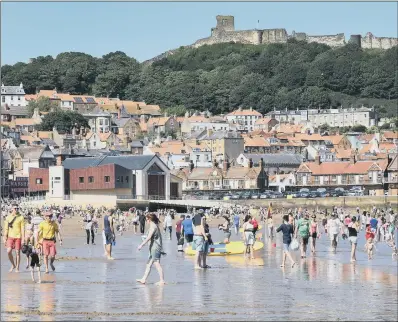  ?? PICTURE: PAUL ATKINSON. ?? THE HEAT IS ON: Sunbathers out in force as temperatur­es soar and Scarboroug­h basks in the sunshine.