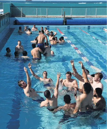  ?? PHOTO: GREGOR RICHARDSON ?? Getting wet . . . Otago players take a dip at the St Clair Hot Salt Water Pool yesterday morning.