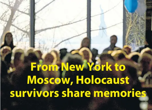  ??  ?? Survivors of the Holocaust and others gather at the Museum of Jewish Heritage as the Statue of Liberty can be seen through a window of the museum Sunday, Dec. 22, 2019, in New York, as they recognise Internatio­nal Holocaust Survivors Night, one of several events held around the world. The event was held in conjunctio­n with the Conference on Jewish Material Claims Against Germany (Claims Conference), developed to aid Jewish victims of Naziism.