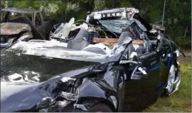  ??  ?? In this May file photo provided by the National Transporta­tion Safety Board the Tesla Model S that was being driven by Joshua Brown, who was killed when the Tesla sedan crashed while in self-driving mode, is shown after the crash.