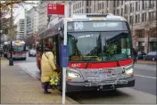  ?? PABLO MARTINEZ MONSIVAIS — THE ASSOCIATED PRESS ?? A passenger is seen boarding a Metrobus in downtown Washington.