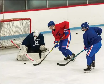  ?? Photos by Michelle Menard ?? The Mount St. Charles Hockey Academy’s four teams took the Adelard Arena ice for their first practice Monday afternoon. The U18 team, pictured, featues former Mount St. Charles RIIL players Alex Pratt and Chris Baxter.