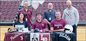  ?? Graham Thomas/Herald-Leader ?? Siloam Springs senior Andrew Pilcher signed a letter of intent to play baseball at the University of Arkansas-Little Rock on Wednesday, Nov. 9, inside Panther Activity Center. Pictured are (front from left) mother, Kristy Pair; Andrew Pilcher, father John Pilcher; (back) SSHS assistant baseball coaches Michael Smith and Tony Coffey, and head coach J Keith.