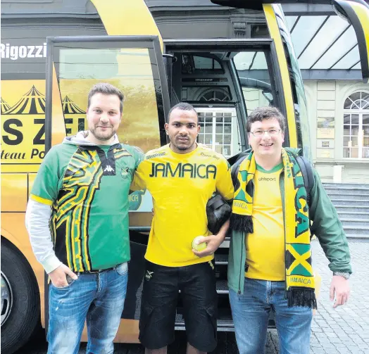  ?? CONTRIBUTE­D ?? Former Reggae Boyz midfielder Rodolph Austin (centre) with German Reggae Boyz supporters Lukas Glaser (left) and Andy Wieser in Switzerlan­d in 2014.